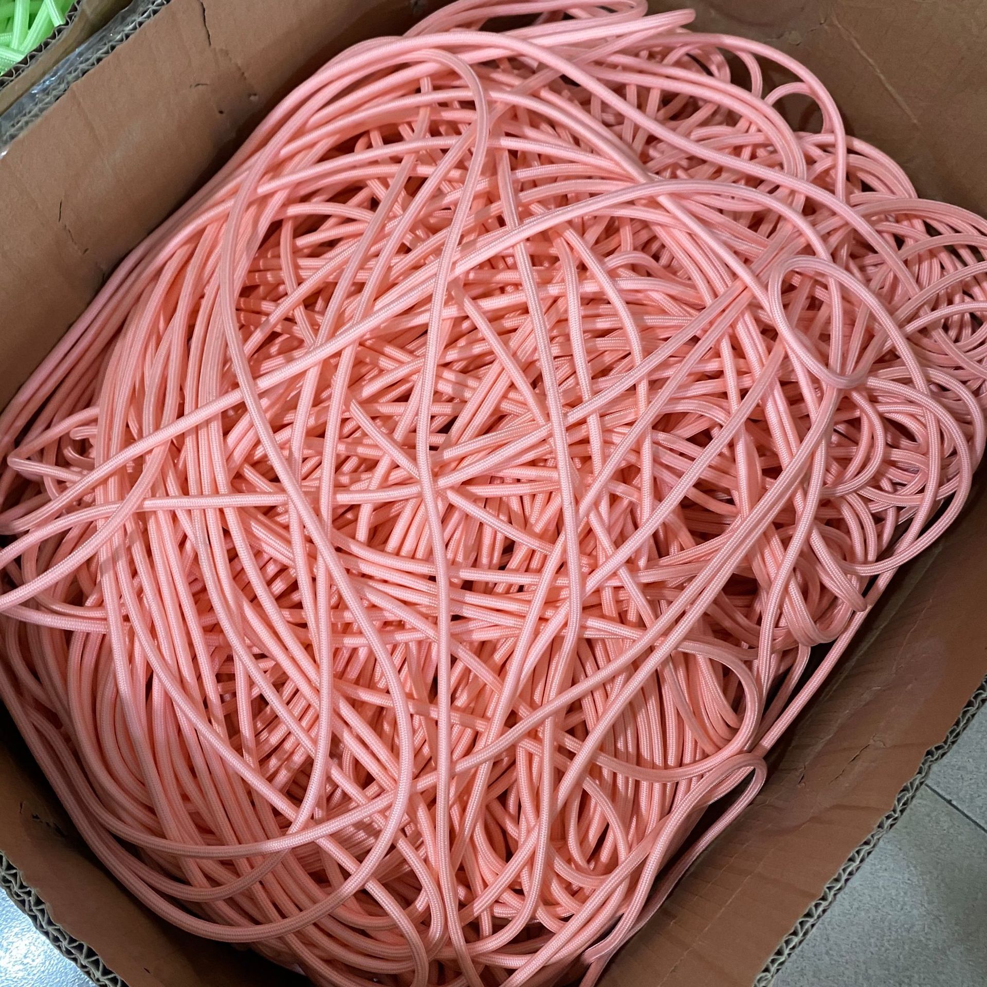 pink rope climbing equipment in a box