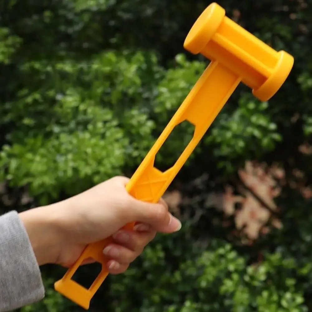 Holding a Outdoor Light Weight Yellow Hammer